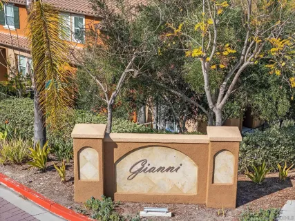 a view of outdoor space with signage and flags