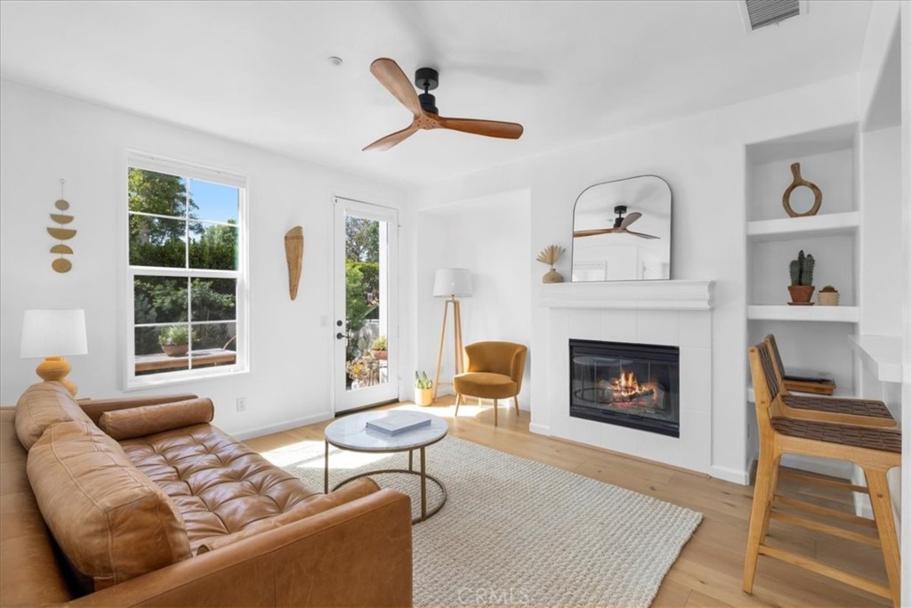 8 Kilbannan Ladera Ranch, CA 92694 - Photo 1 of 1 a living room with furniture and a fireplace