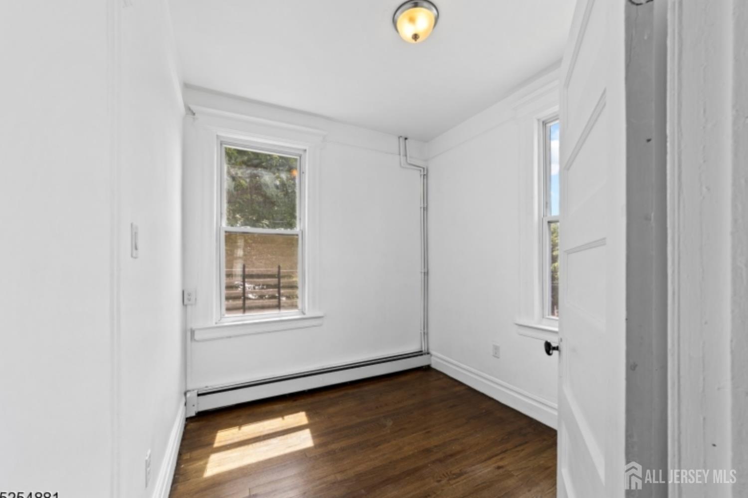 410 Chadwick Avenue, Unit 2 Newark, NJ 07112 - Photo 11 of 11 a view of an empty room and window