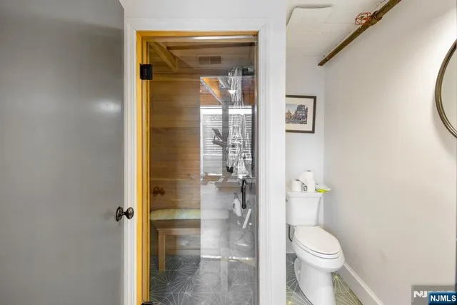 a bathroom with a toilet and shower