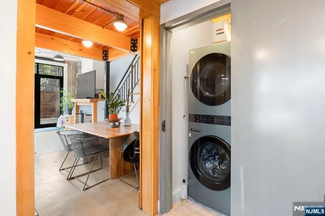 a view of a hallway with washer and dryer