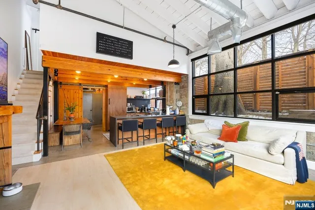 a living room with furniture and a table