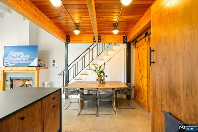 a dining room with furniture and a window