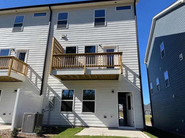 a view of a house with a door and balcony