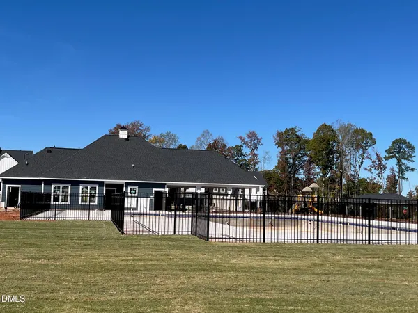a view of a house with swimming pool
