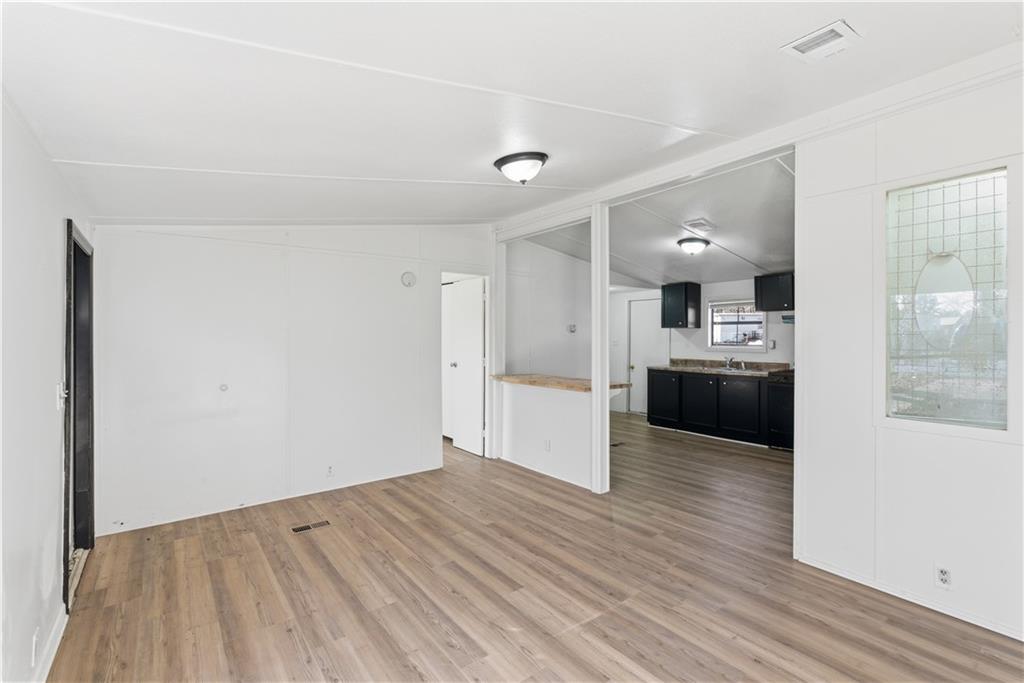 129 Rising Fawn Trail Northeast Rome, GA 30165 - Photo 11 of 28 a view of a kitchen and kitchen island wooden floor
