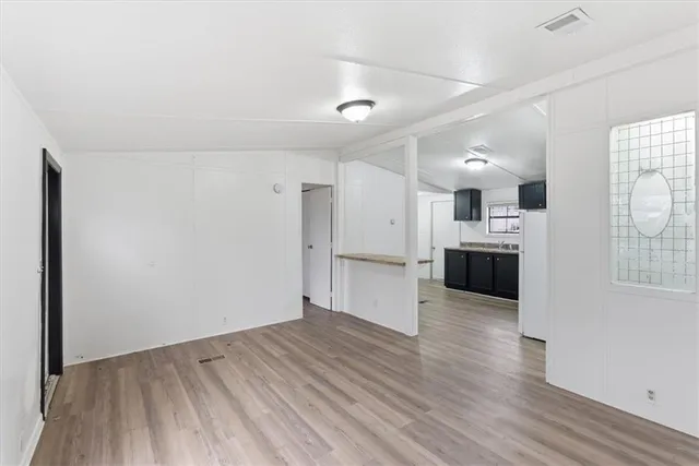 a kitchen with stainless steel appliances granite countertop a stove and a sink