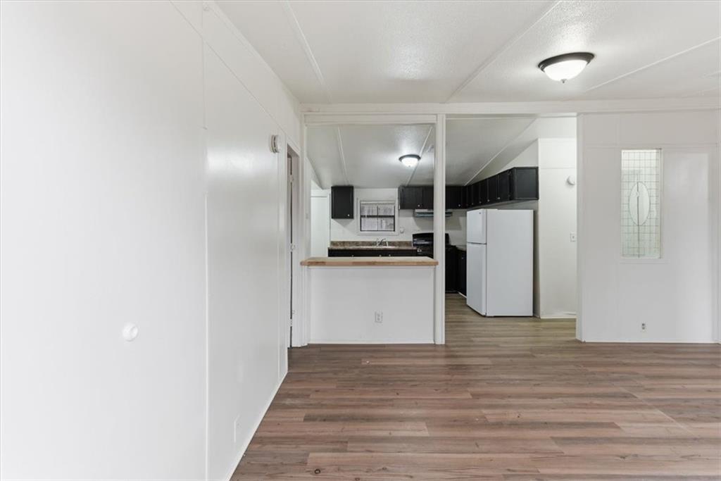 129 Rising Fawn Trail Northeast Rome, GA 30165 - Photo 16 of 28 a view of kitchen refrigerator and microwave