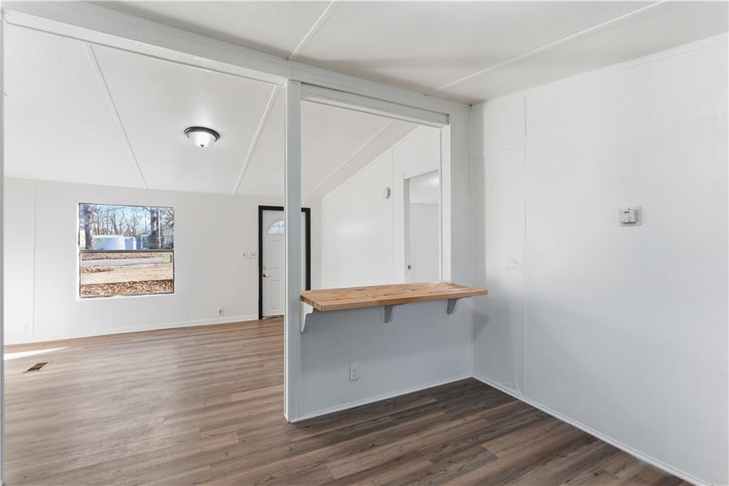 129 Rising Fawn Trail Northeast Rome, GA 30165 - Photo 17 of 28 an empty room with wooden floor and window