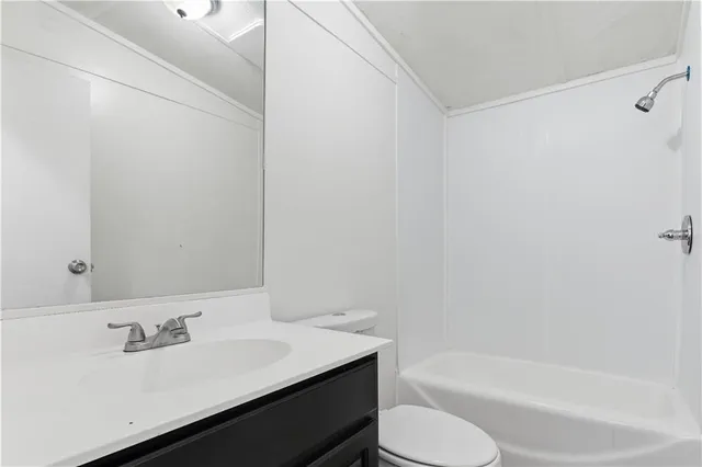 a bathroom with a sink toilet and bathtub