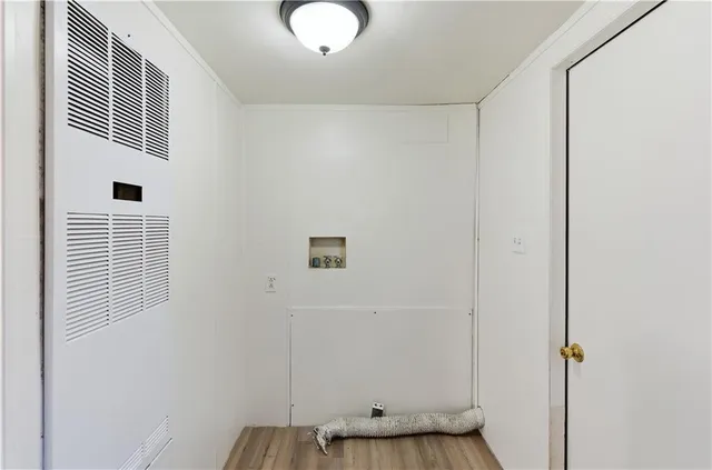 a view of a livingroom with wooden floor