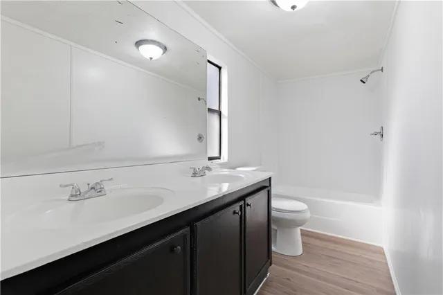 a bathroom with a sink toilet and bathtub