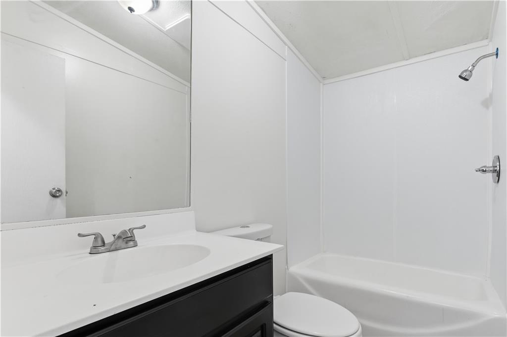 129 Rising Fawn Trail Northeast Rome, GA 30165 - Photo 21 of 28 a bathroom with a sink toilet and bathtub