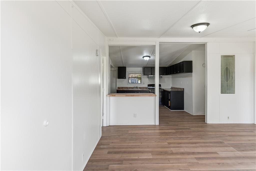 129 Rising Fawn Trail Northeast Rome, GA 30165 - Photo 9 of 28 a view of kitchen with refrigerator microwave and stove