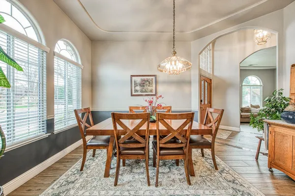 a bedroom with bed and wooden floor