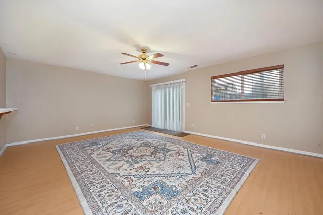 a view of a kitchen with a stove cabinets and a rug