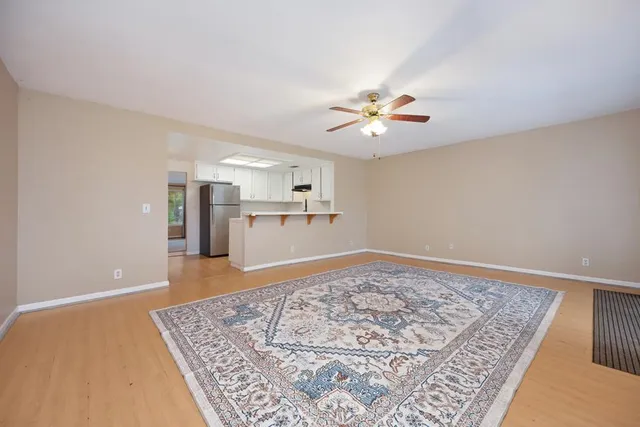 a view of a kitchen with an empty space and kitchen view