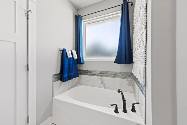 a bathroom with a bathtub