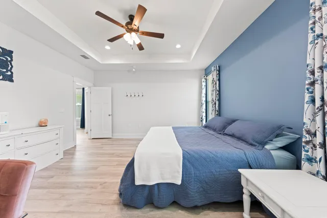 a bedroom with a bed and a dresser