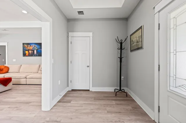 a view of a livingroom with furniture and windows