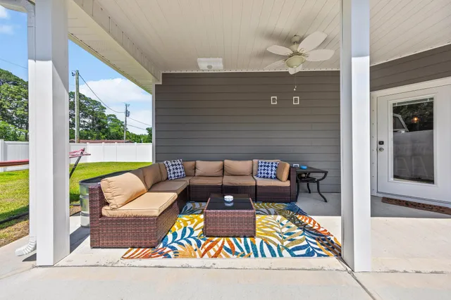 a view of a balcony with furniture