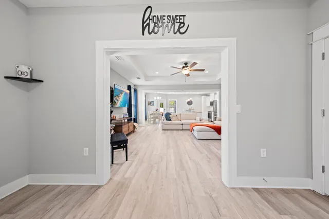 a view of living room with furniture and wooden floor