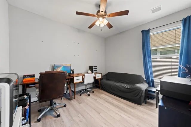 a living room with furniture and a window