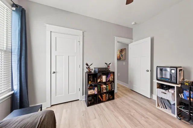 a view of a livingroom with furniture and workspace