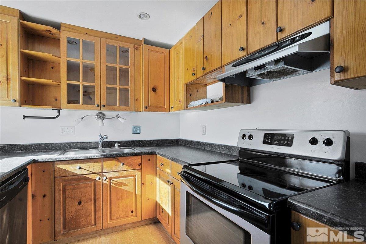 1630 Dayton Way Reno, NV 89502 - Photo 20 of 36 a kitchen with a stove and a microwave