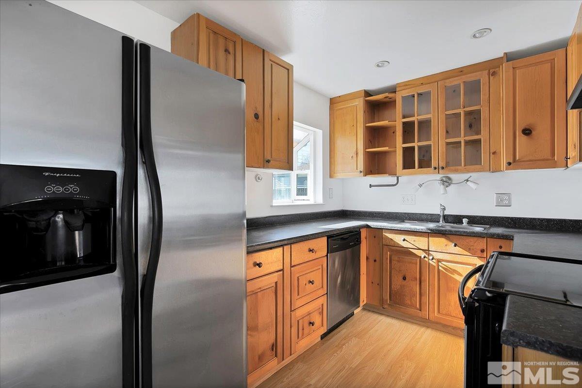 1630 Dayton Way Reno, NV 89502 - Photo 2 of 36 a kitchen with stainless steel appliances granite countertop a refrigerator and a sink