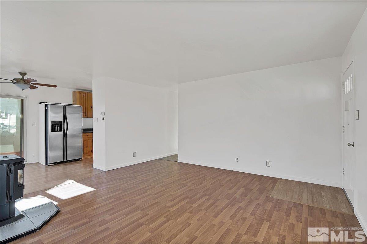 1630 Dayton Way Reno, NV 89502 - Photo 22 of 36 a view of empty room with wooden floor