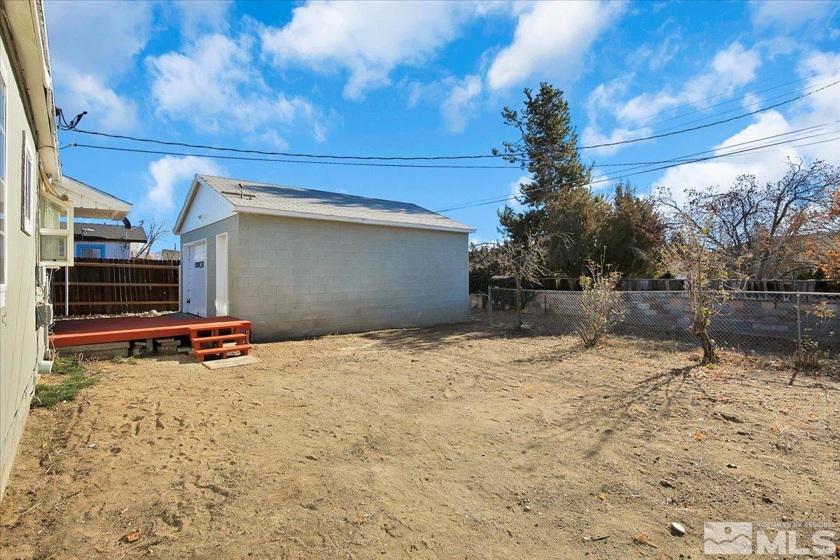 1630 Dayton Way Reno, NV 89502 - Photo 29 of 36 a backyard of a house with lots of trees and plants