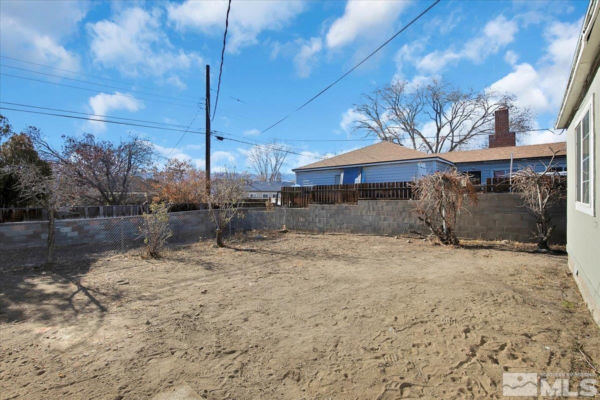 1630 Dayton Way Reno, NV 89502 - Photo 30 of 36 a view of a dry yard with wooden fence