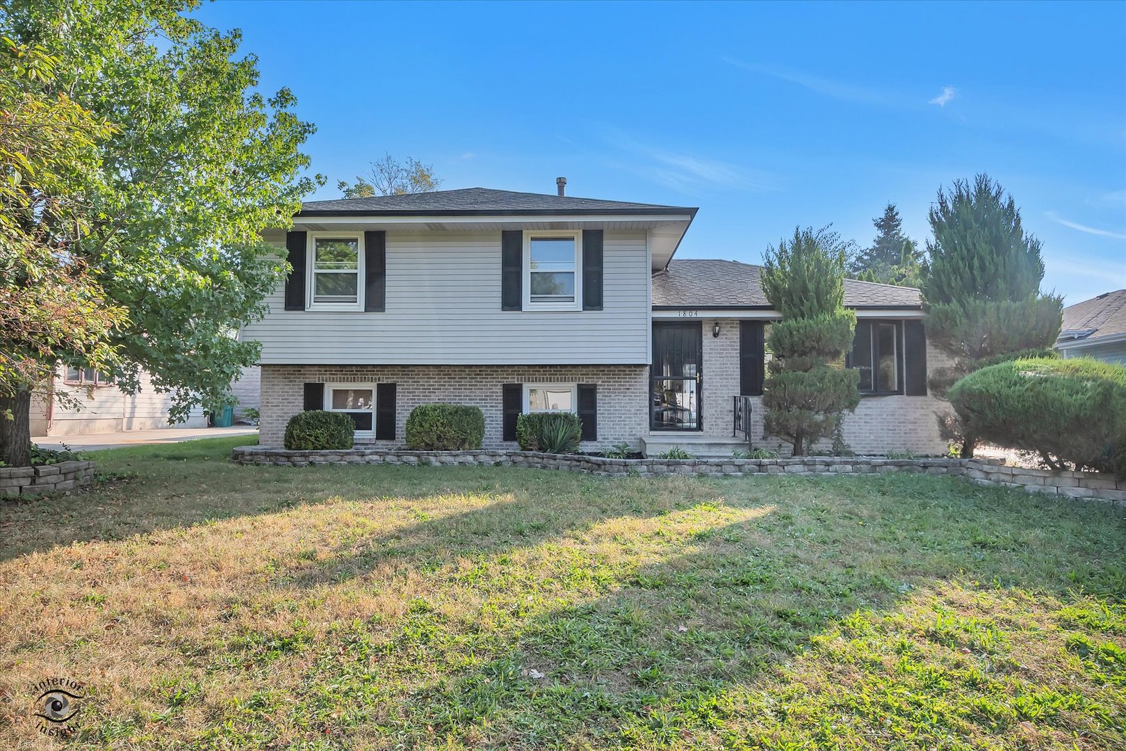 1804 Maserati Drive Joliet, IL 60435 - Photo 1 of 25 a view of a yard in front of house