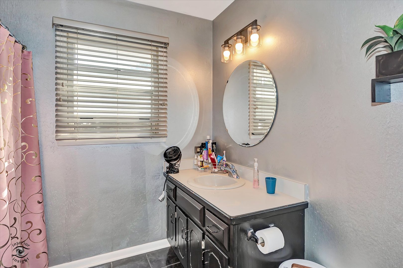 1804 Maserati Drive Joliet, IL 60435 - Photo 11 of 25 a bathroom with a sink a mirror and a window
