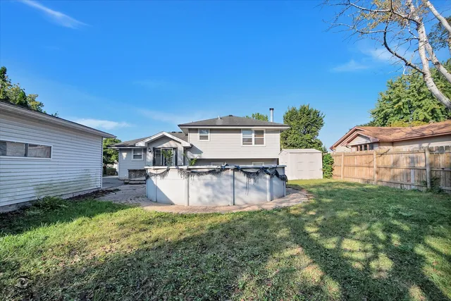 a view of a house with a yard porch and sitting area