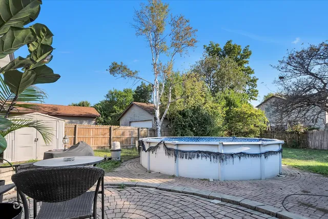 a view of a chairs and table in the patio