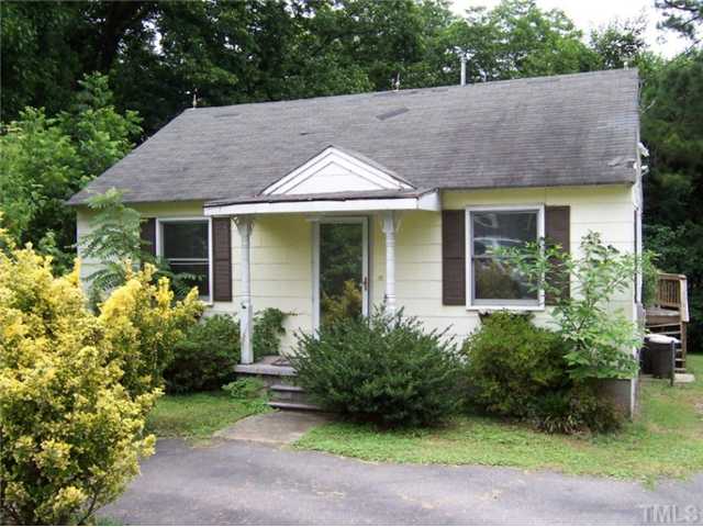 2621 Layden Street Raleigh, NC 27603 - Photo 1 of 9 a view of a house with a yard plants and large tree