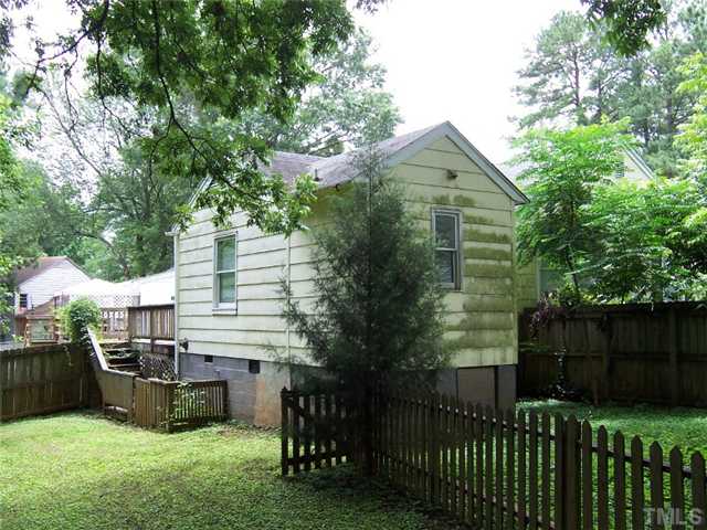 2621 Layden Street Raleigh, NC 27603 - Photo 3 of 9 a view of a house with a yard and furniture