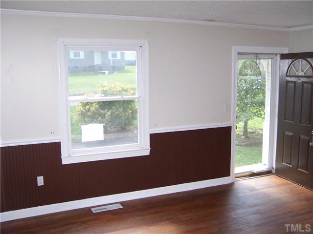 2621 Layden Street Raleigh, NC 27603 - Photo 5 of 9 an empty room with wooden floor and windows
