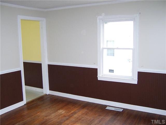 2621 Layden Street Raleigh, NC 27603 - Photo 6 of 9 an empty room with a window