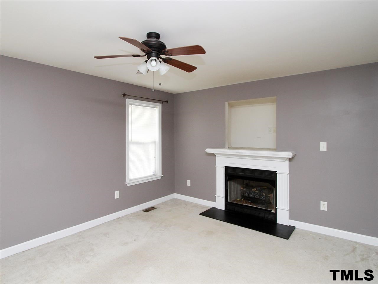 4409 Archibald Way Raleigh, NC 27616 - Photo 2 of 23 a view of an empty room with window and fireplace