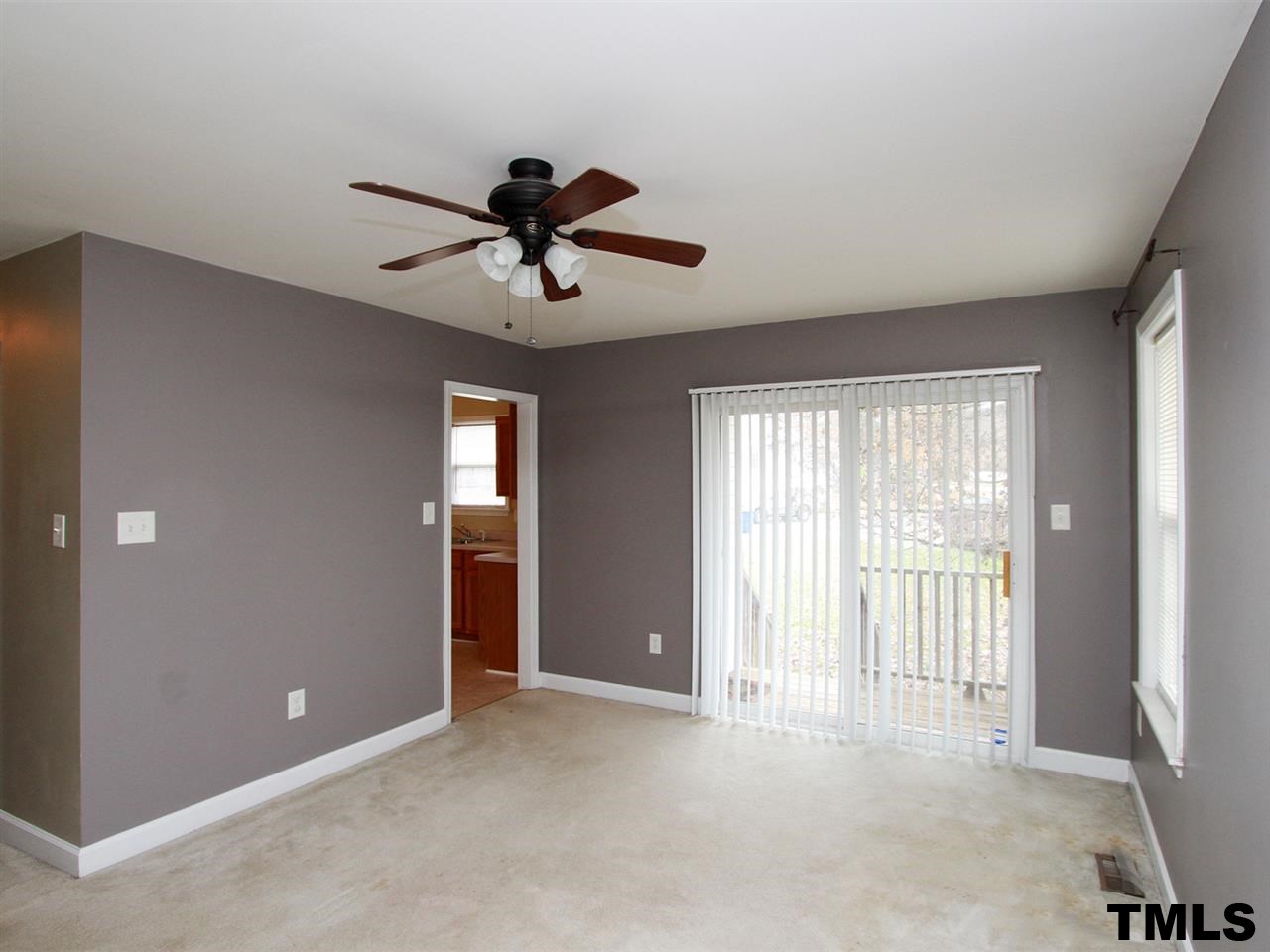 4409 Archibald Way Raleigh, NC 27616 - Photo 4 of 23 a view of a livingroom with a ceiling fan and window