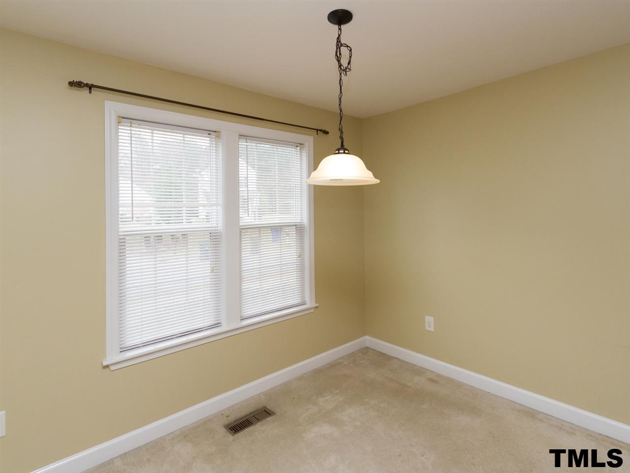 4409 Archibald Way Raleigh, NC 27616 - Photo 5 of 23 a view of an empty room with a window