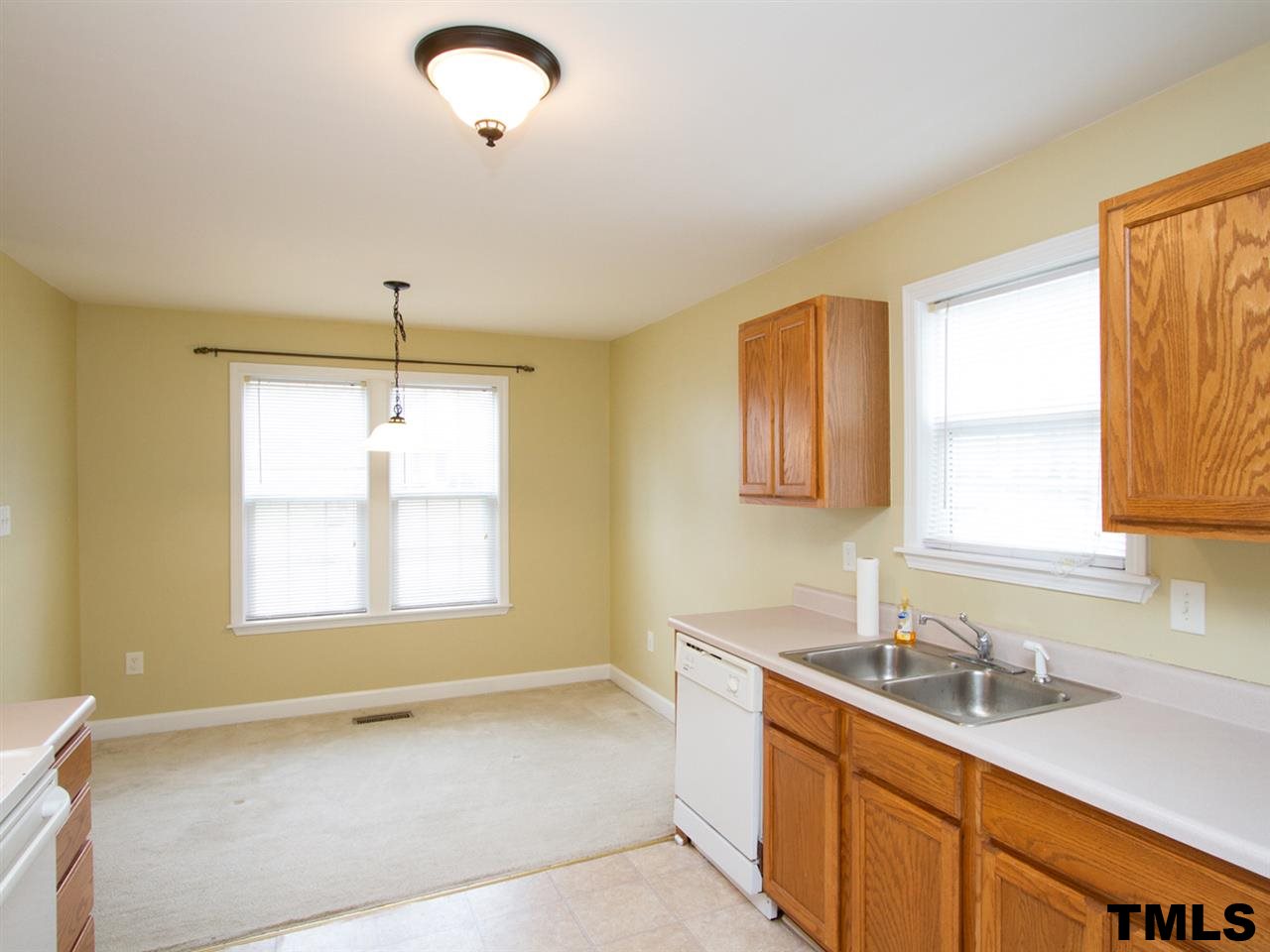 4409 Archibald Way Raleigh, NC 27616 - Photo 6 of 23 a bathroom with a sink and a window