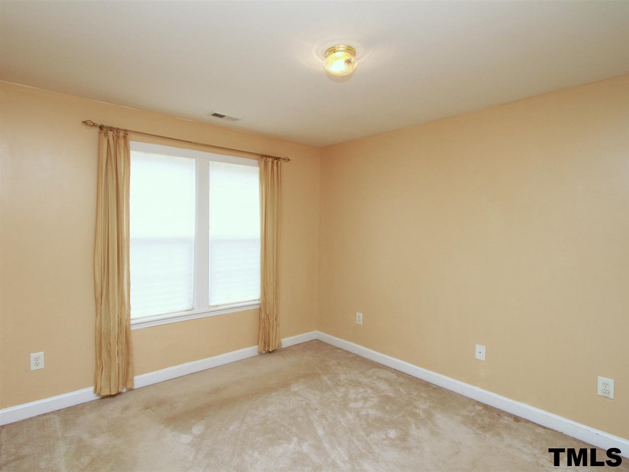 4409 Archibald Way Raleigh, NC 27616 - Photo 10 of 23 an empty room with a window