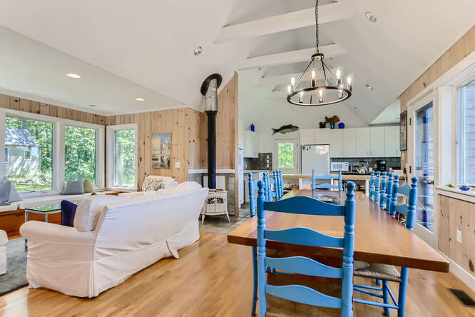 14 Ephriam Allen Road West Tisbury, MA 02568 - Photo 5 of 17 a living room with fireplace chandelier and a view of kitchen