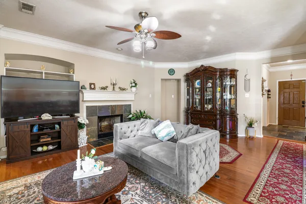 a living room with furniture and a fireplace