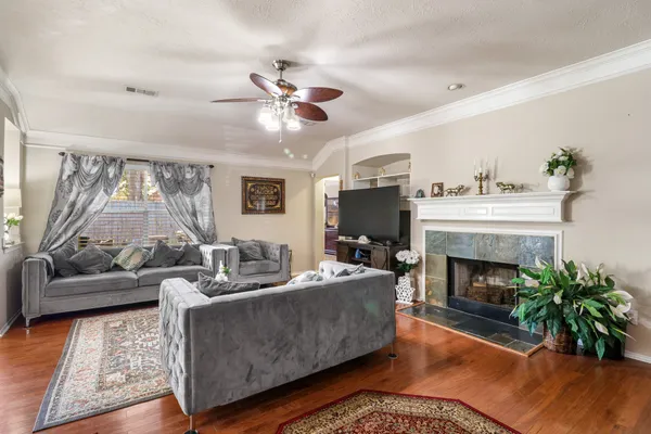 a living room with furniture and a fireplace
