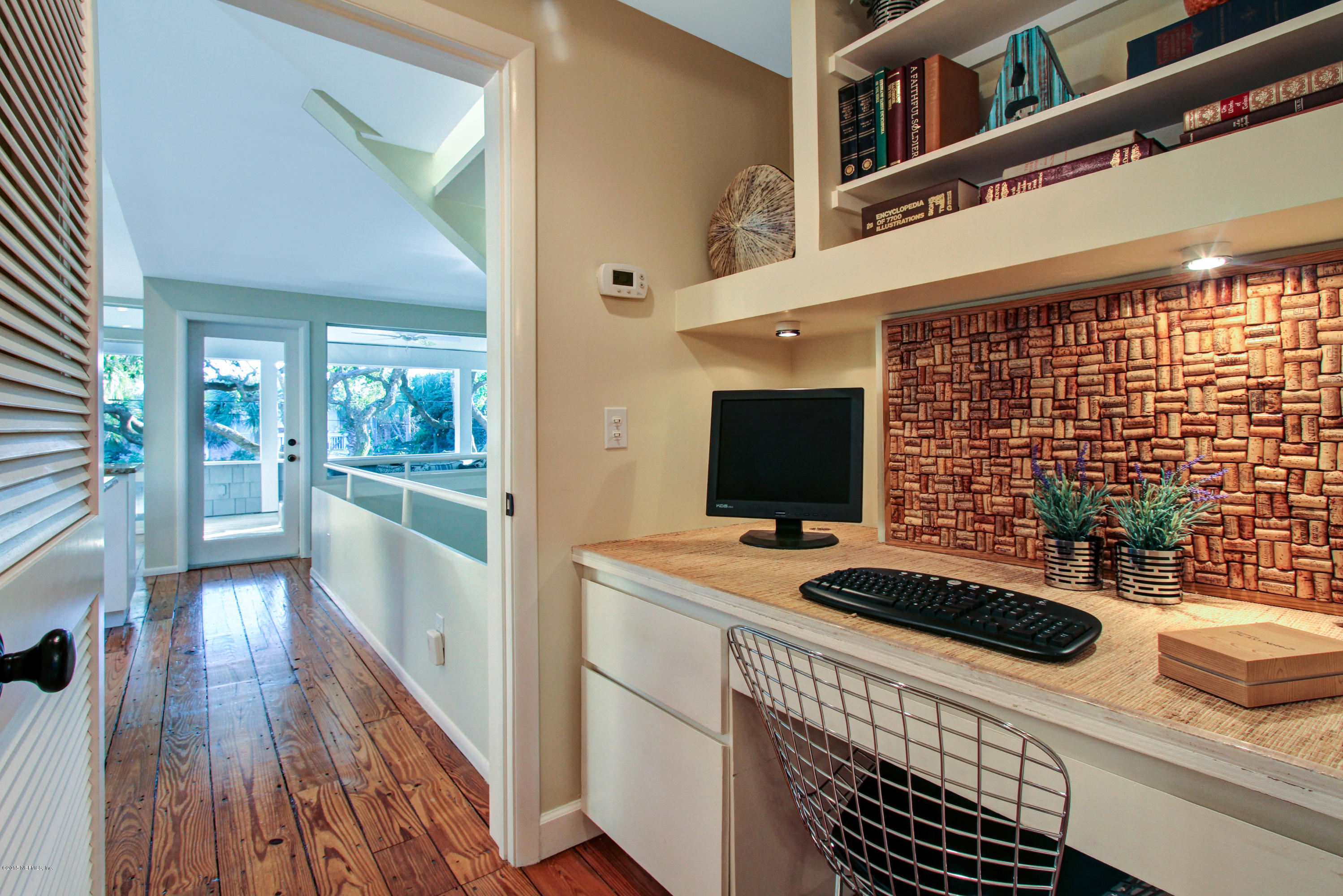 71 19th Street Atlantic Beach, FL 32233 - Photo 14 of 30 a bedroom with a bed and a flat screen tv